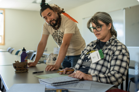 Spanish Instructor helping student with spanish lesson